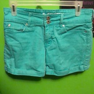 Turquoise Levi denim shorts.